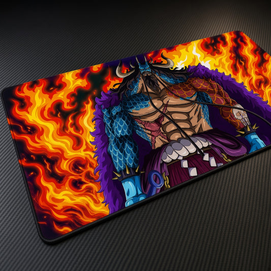 Kaido Flames One Piece Playmat at an angle on a gaming desk
