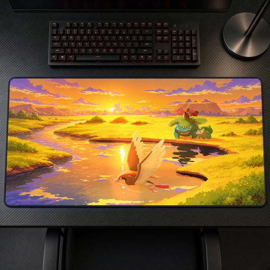 Pidgeot & Venusaur Sunset Pokémon Playmat on a gaming desk, top-down view