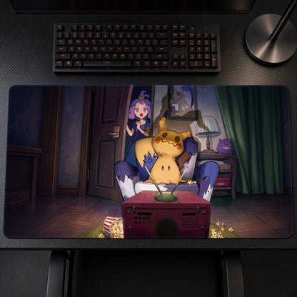 Acerola and Mimikyu Gaming Night Pokémon Playmat on a gaming desk, top-down view