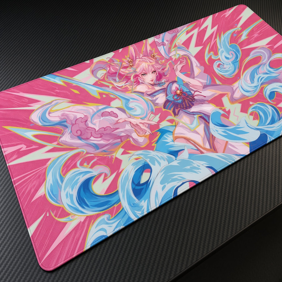 Ahri Pink Waves League of Legends Playmat at an angle on a gaming desk