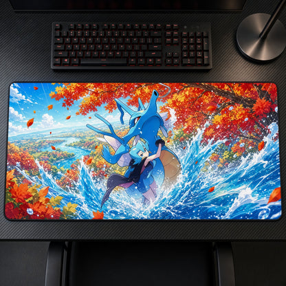 Clair & Kingdra Autumn Splash Pokémon Playmat on a gaming desk, top-down view