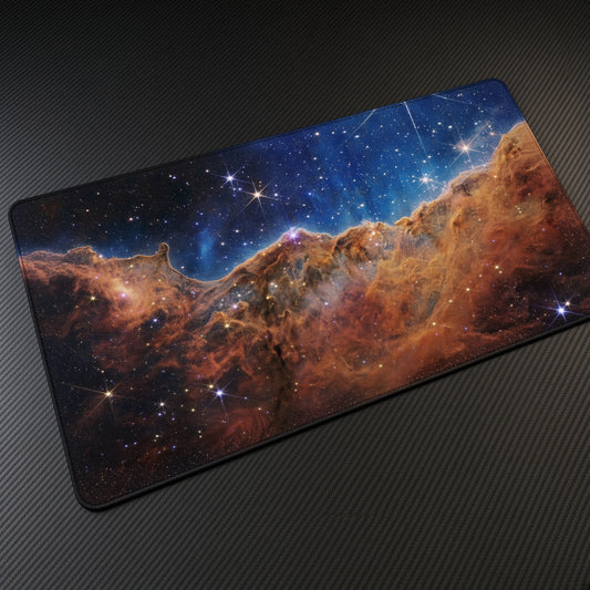 Cosmic Cliffs, Carina Nebula (Webb) Space Playmat at an angle on a gaming desk