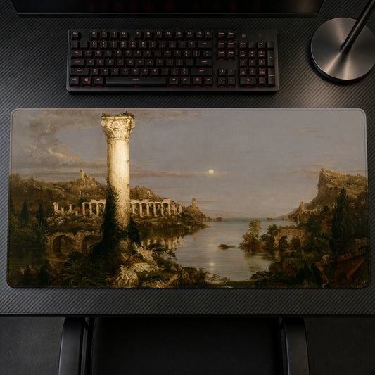 The Course of Empire: Desolation Thomas Cole Playmat on a gaming desk, top-down view