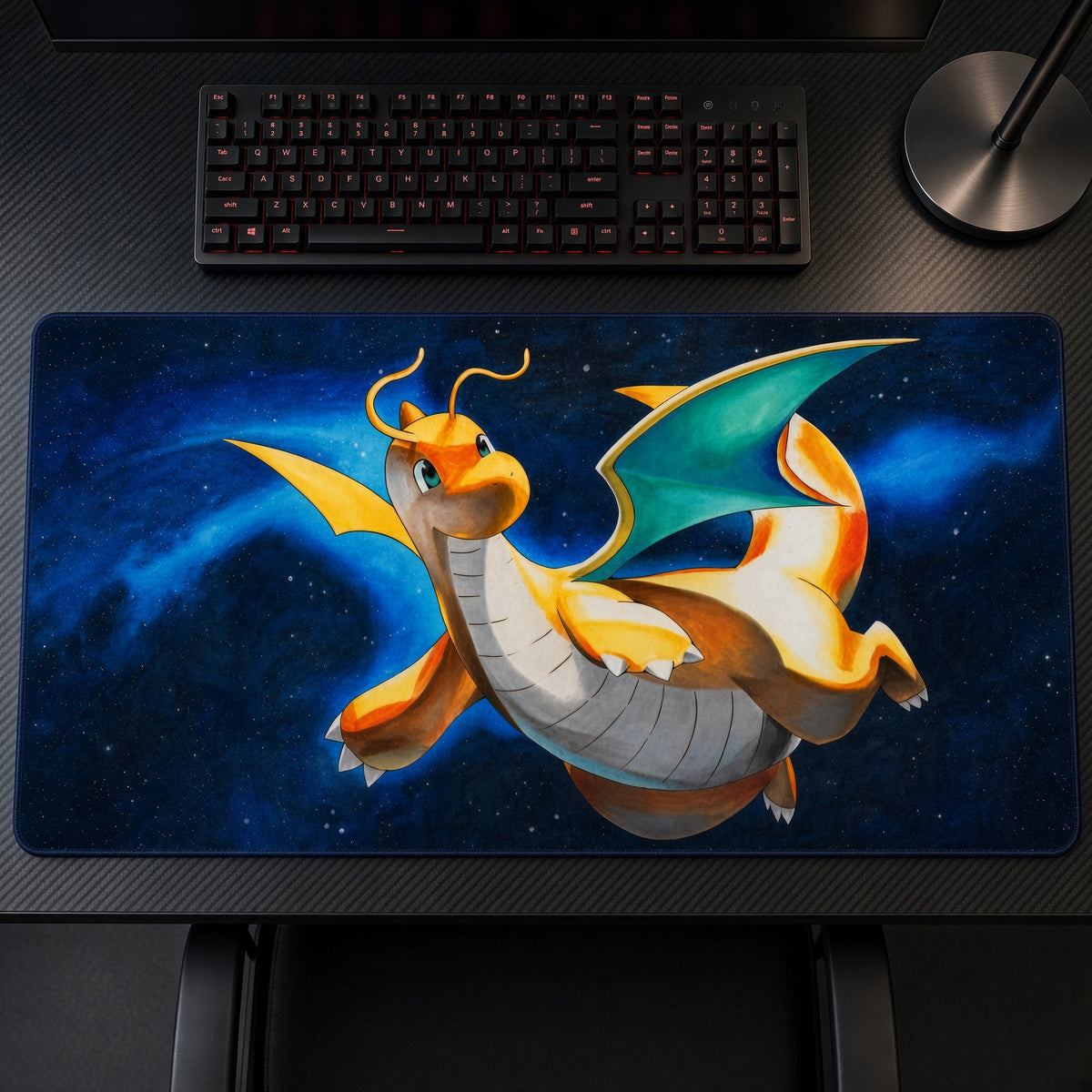 Dragonite Night Flight Pokémon Playmat on a gaming desk, top-down view