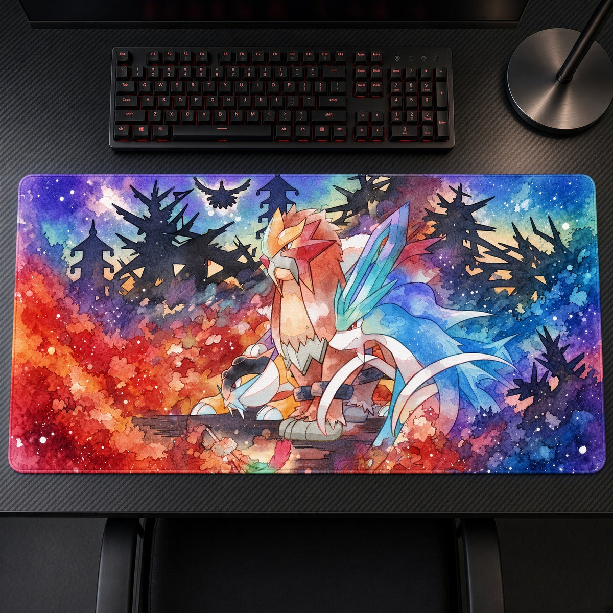 Entei, Raikou & Suicune Watercolor Forest Pokémon Playmat on a gaming desk, top-down view