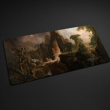 Expulsion from the Garden of Eden Thomas Cole Playmat at an angle on a gaming desk