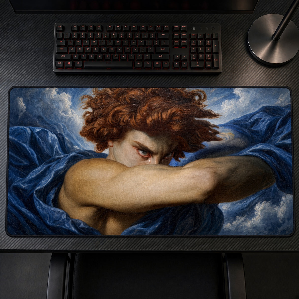 Fallen Angel Alexandre Cabanel Playmat on a gaming desk, top-down view