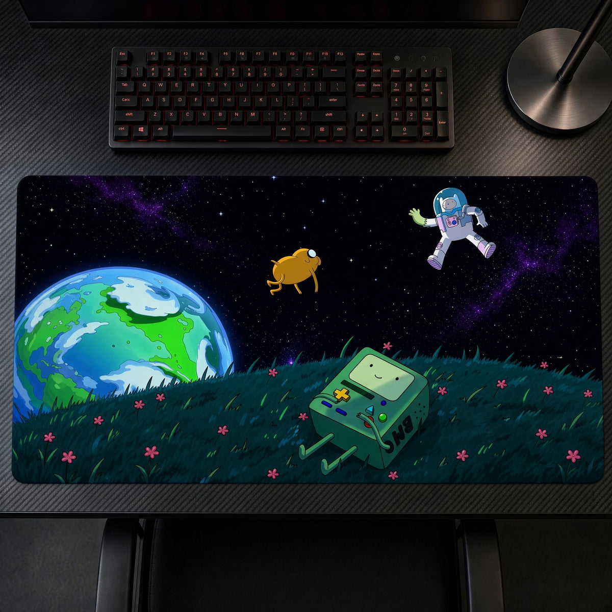 Finn, Jake and BMO Space Adventure Time Playmat on a gaming desk, top-down view