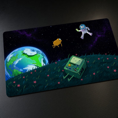 Finn, Jake and BMO Space Adventure Time Playmat at an angle on a gaming desk