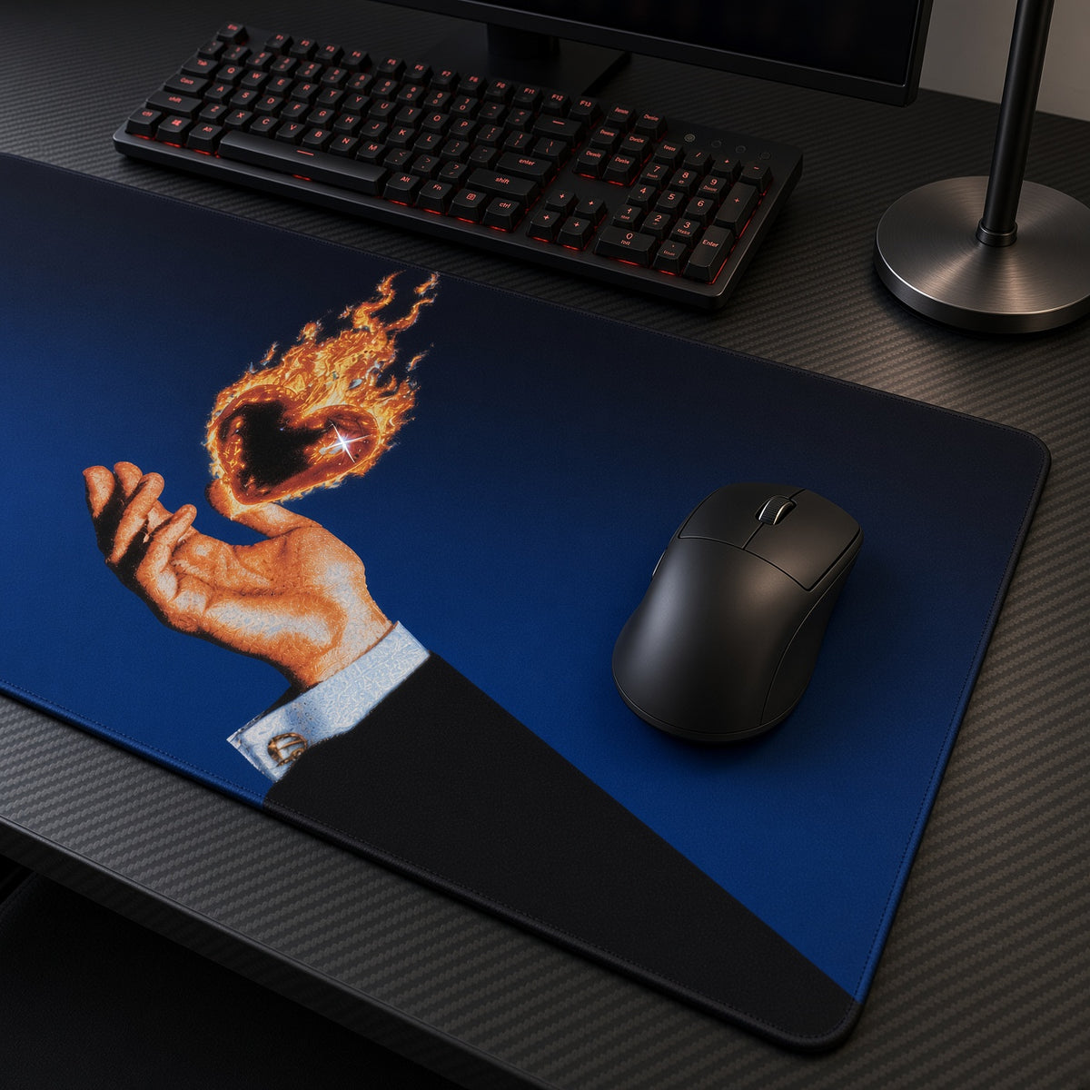 Flaming Heart in Hand Playmat at an angle with keyboard and mouse
