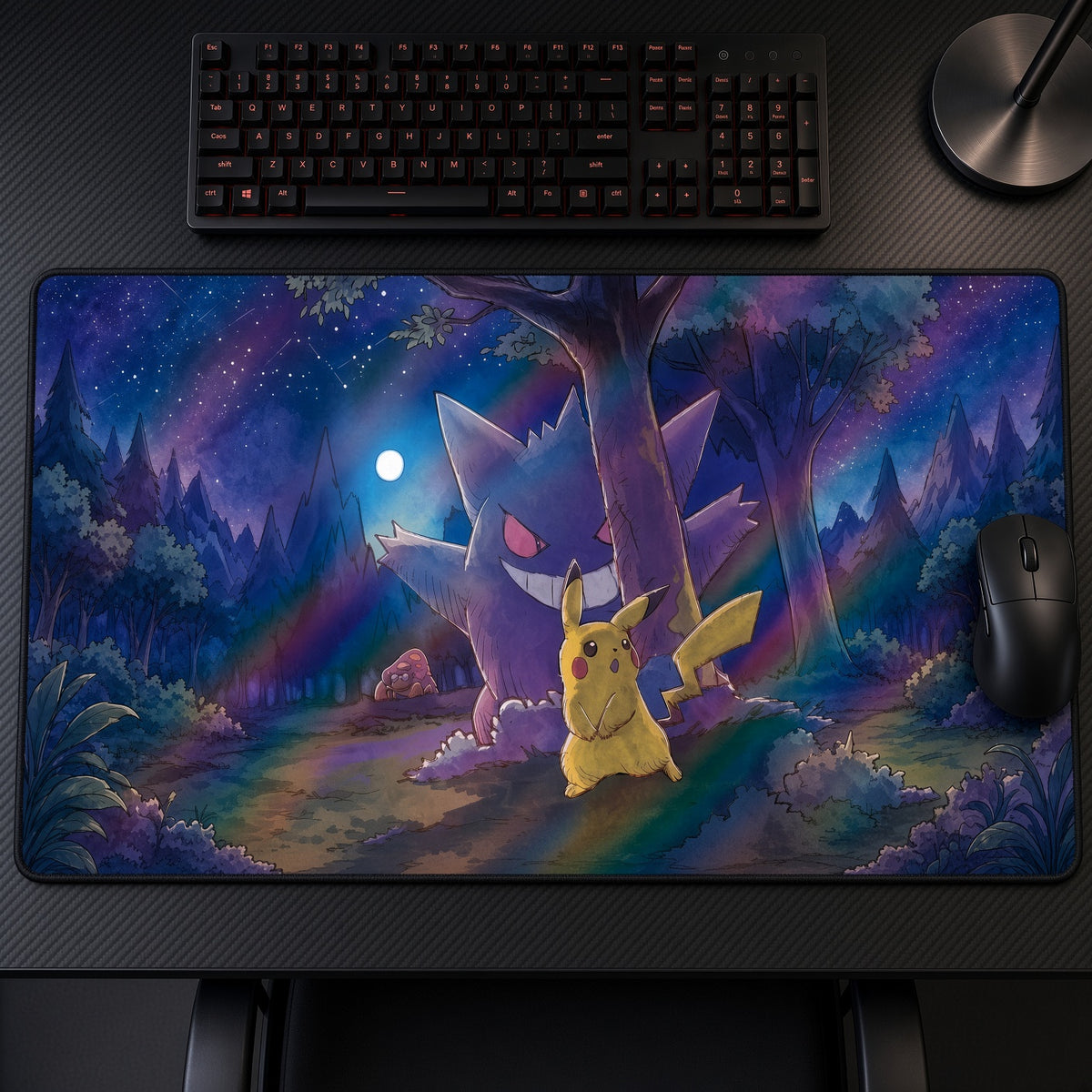 Gengar & Pikachu Night Forest Pokémon Playmat on a gaming desk, top-down view