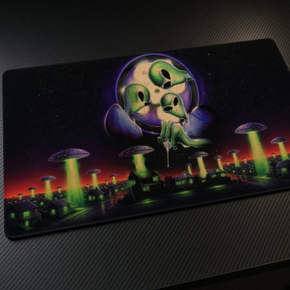 Green Aliens UFO Invasion Playmat at an angle on a gaming desk