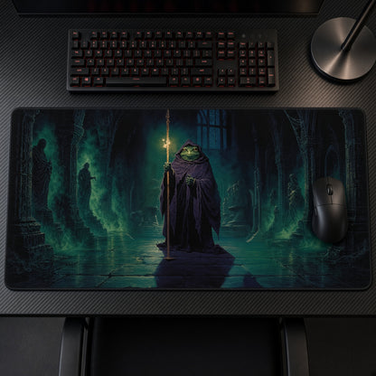 Hooded Frog Wizard Green Crypt Playmat on a gaming desk, top-down view