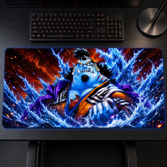 Jinbe Ocean Waves One Piece Playmat on a gaming desk, top-down view