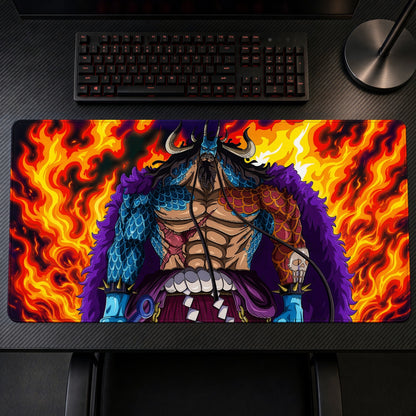 Kaido Flames One Piece Playmat on a gaming desk, top-down view
