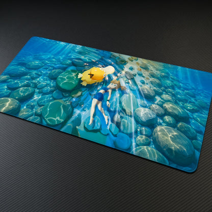 Misty and Psyduck Underwater Pokémon Playmat at an angle on a gaming desk