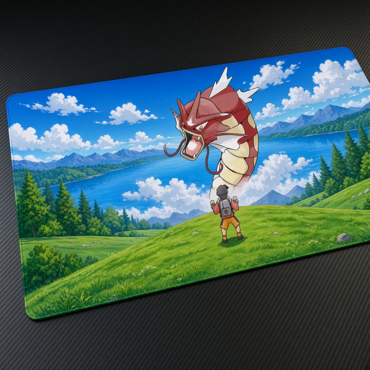 Red Gyarados Lakeside Encounter Pokémon Playmat at an angle on a gaming desk