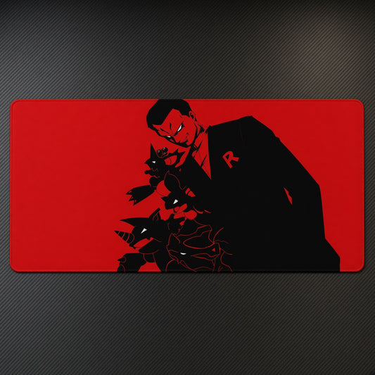 Red Noir Boss Silhouette Playmat at an angle on a gaming desk