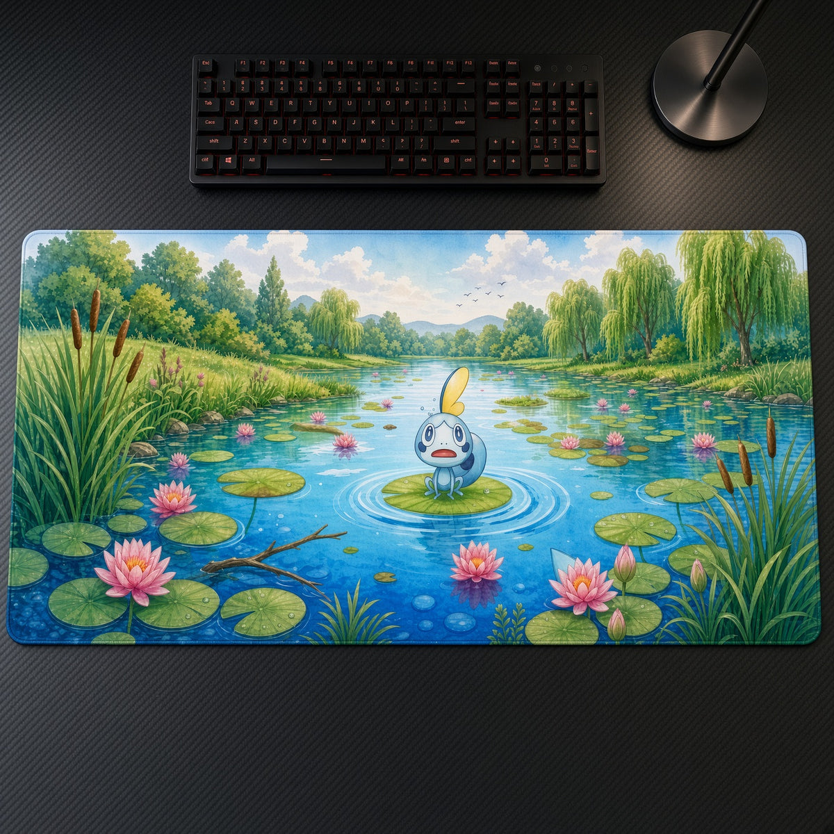 Sobble Lily Pond Pokémon Playmat on a gaming desk, top-down view