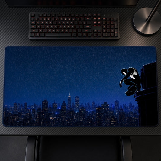 Symbiote Spider-Man Rain City Playmat on a gaming desk, top-down view
