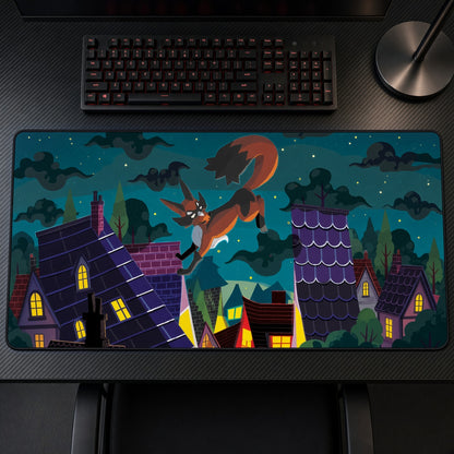 Thievul Night Village Pokémon Playmat on a gaming desk, top-down view