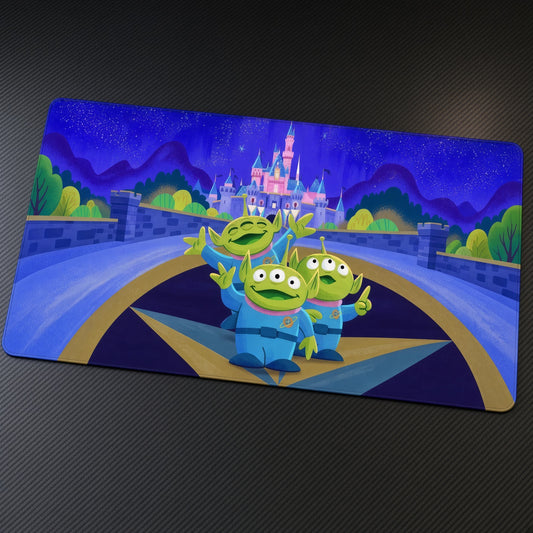 Toy Story Aliens Disney Castle Playmat at an angle on a gaming desk
