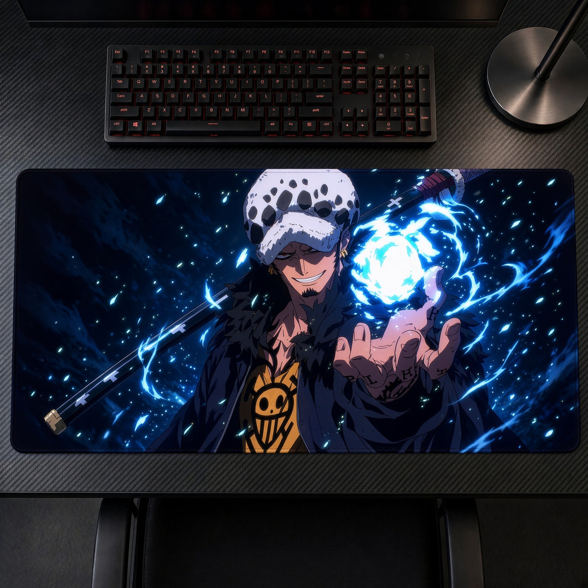 Trafalgar Law One Piece Playmat on a gaming desk, top-down view