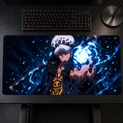 Trafalgar Law One Piece Playmat on a gaming desk, top-down view