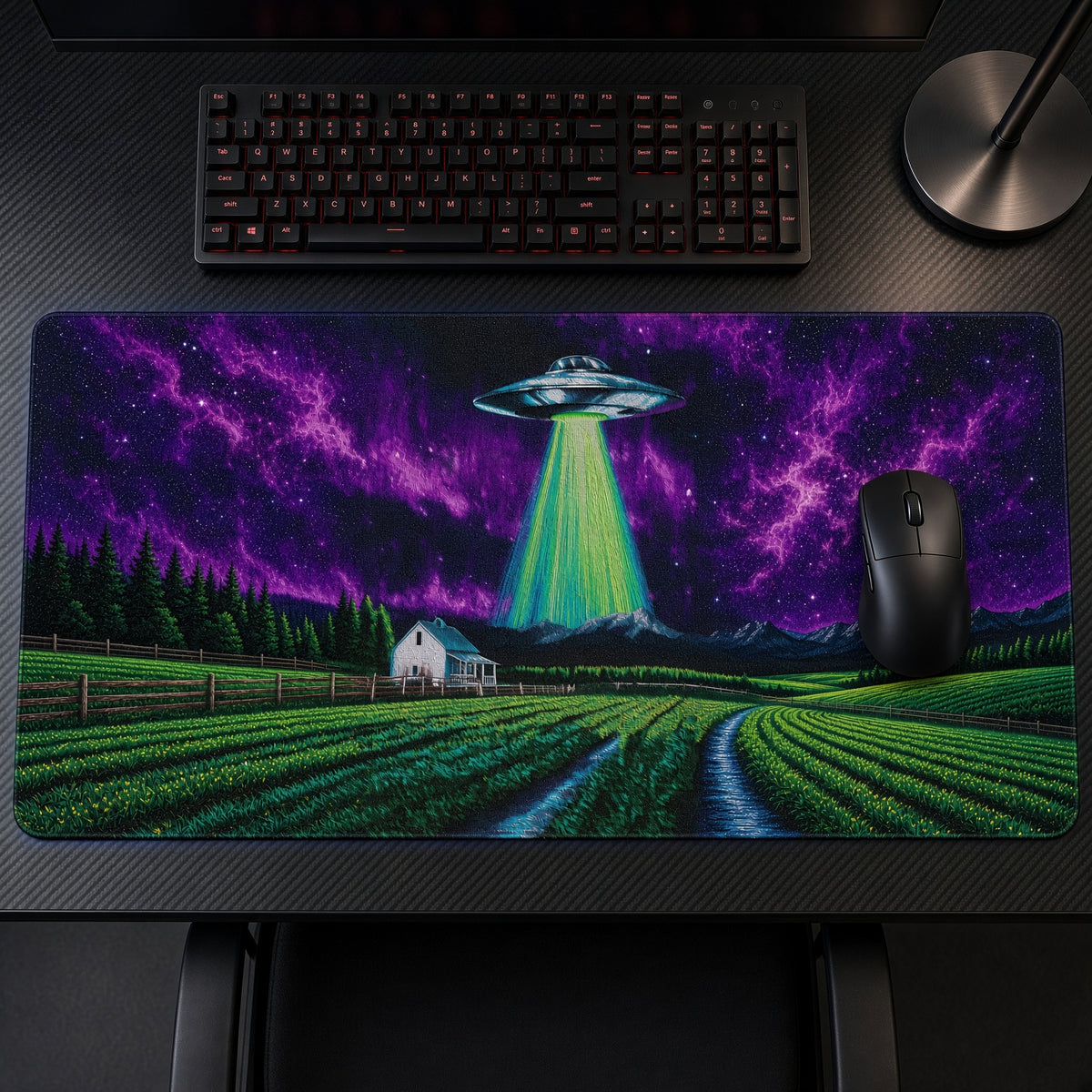 UFO Abduction Farm Night Playmat on a gaming desk, top-down view