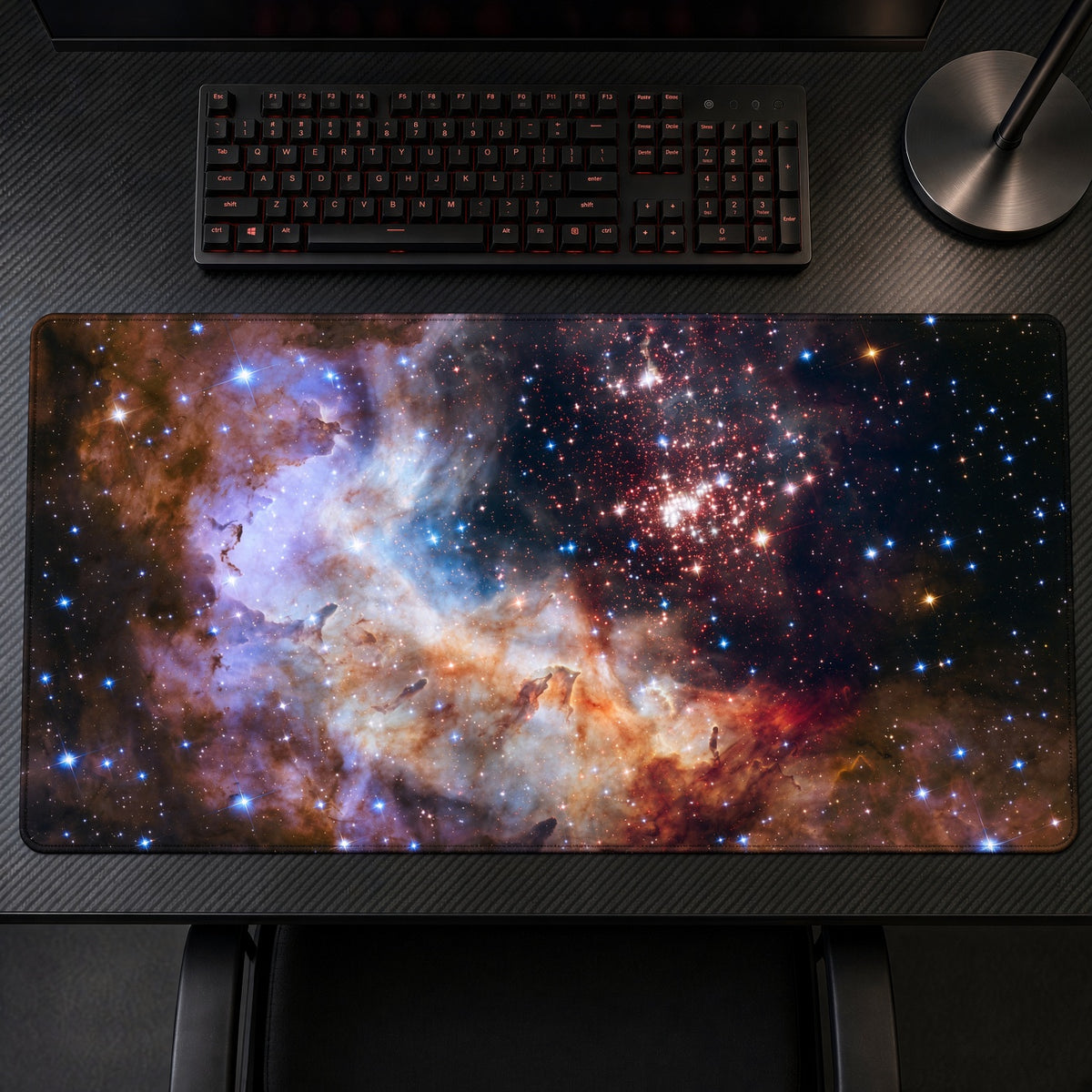 Westerlund 2 Celestial Fireworks (Hubble) Space Playmat on a gaming desk, top-down view