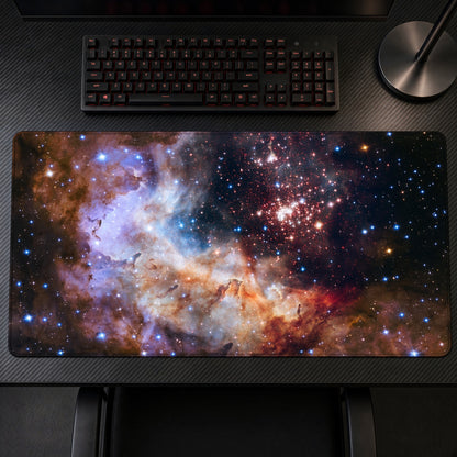 Westerlund 2 Celestial Fireworks (Hubble) Space Playmat on a gaming desk, top-down view