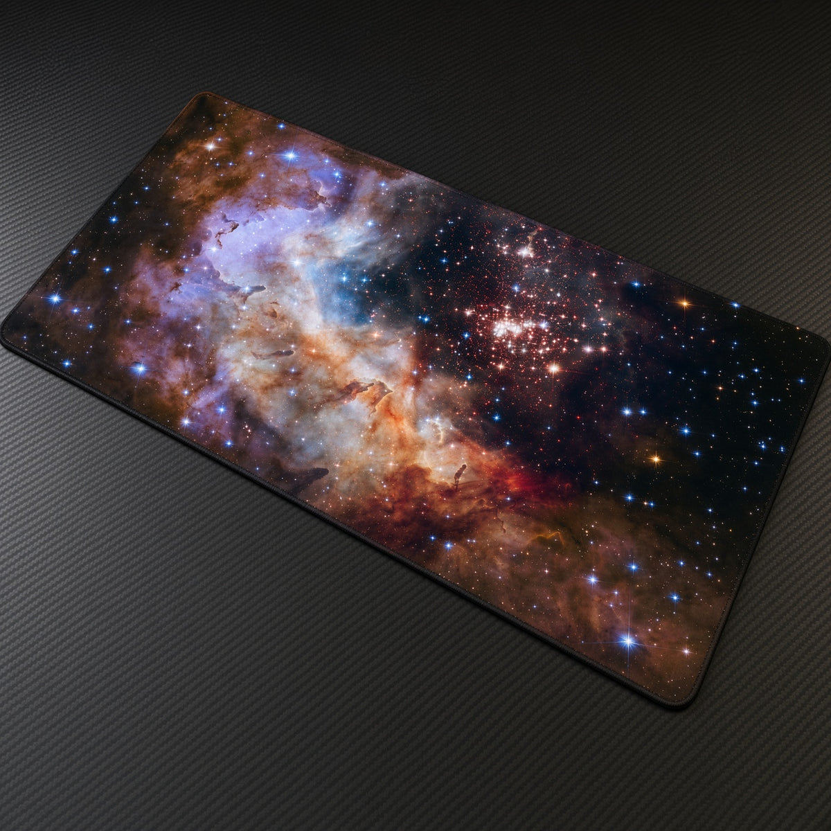 Westerlund 2 Celestial Fireworks (Hubble) Space Playmat at an angle on a gaming desk