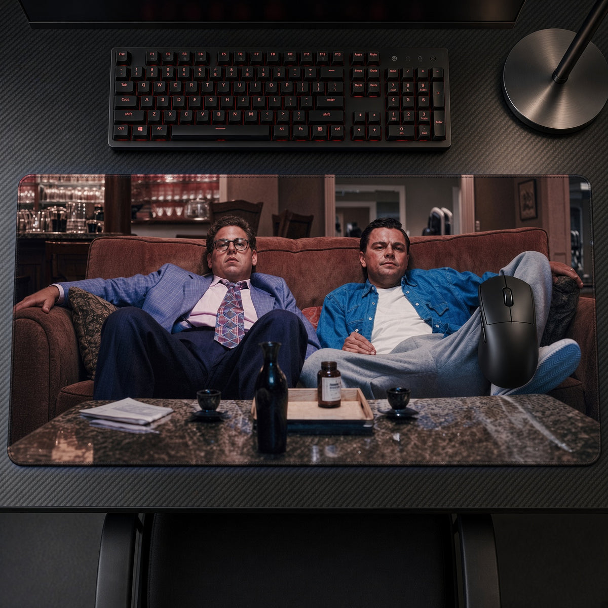 Wolf of Wall Street Couch Playmat on a gaming desk, top-down view