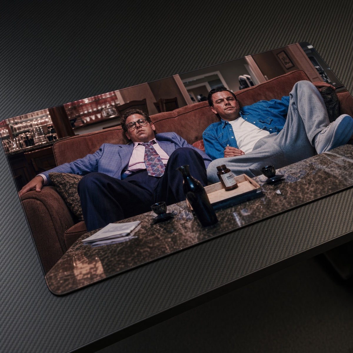 Wolf of Wall Street Couch Playmat at an angle on a gaming desk
