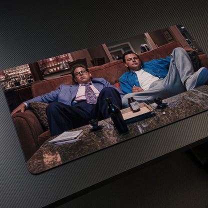 Wolf of Wall Street Couch Playmat at an angle on a gaming desk