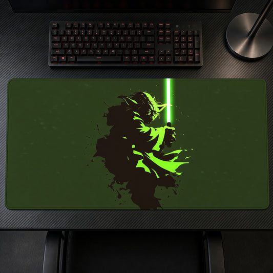 Yoda Green Lightsaber Star Wars Playmat on a gaming desk, top-down view
