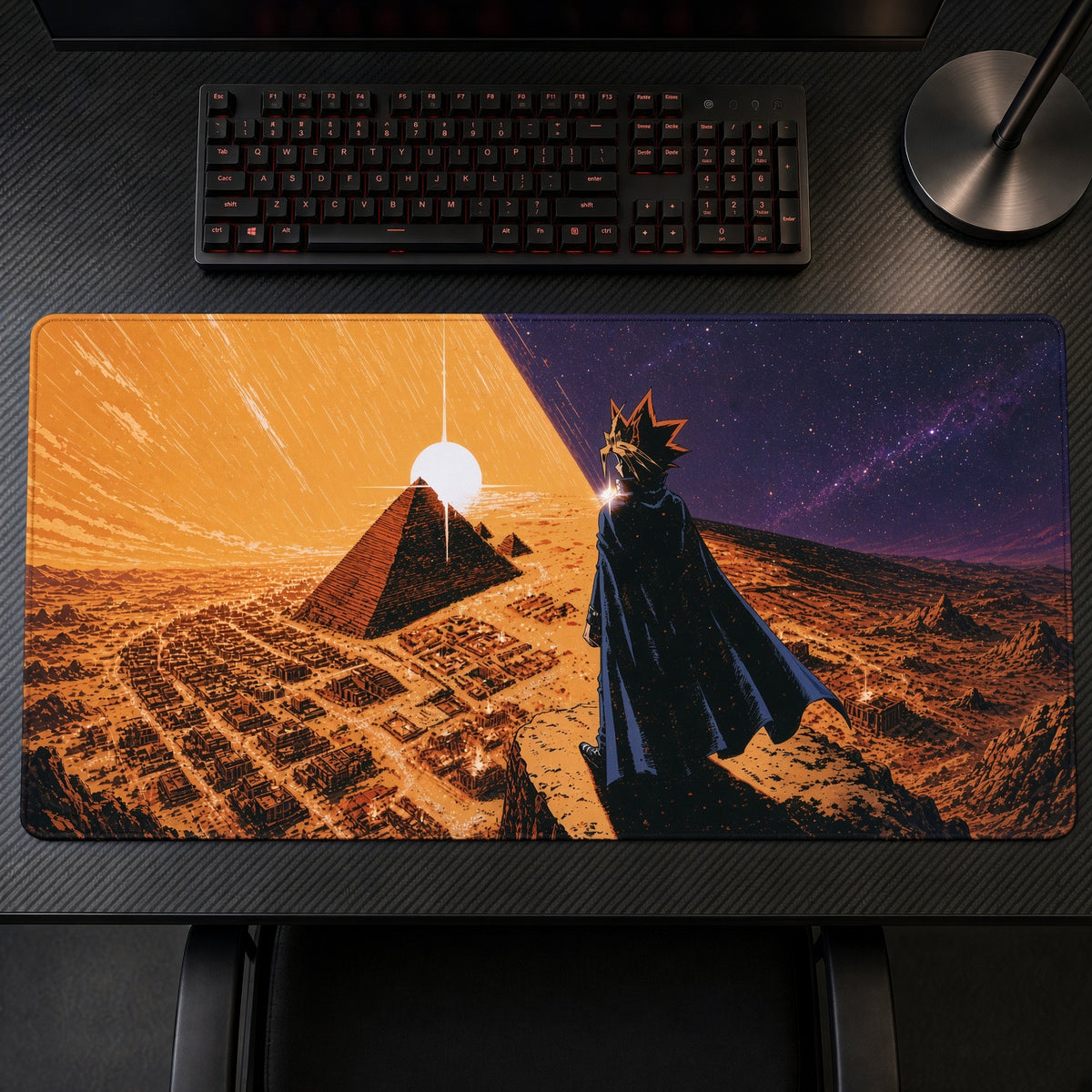 Yugi and Atem Pyramid Sunset Yu-Gi-Oh! Playmat on a gaming desk, top-down view