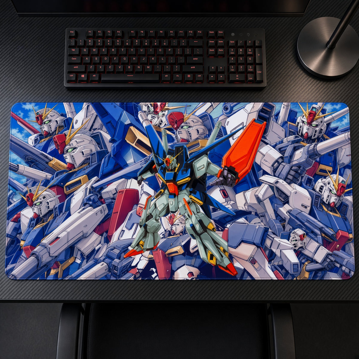 ZZ Gundam Mobile Suit Collage Playmat on a gaming desk, top-down view
